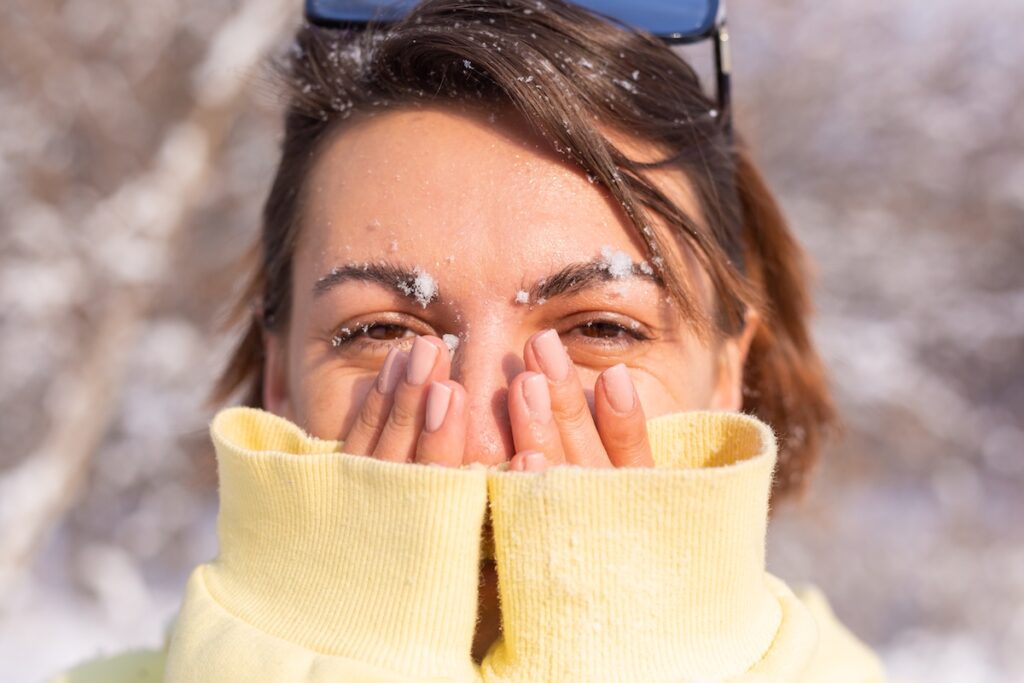 portrait young woman winter forest sunny day with snow white smile fooling around