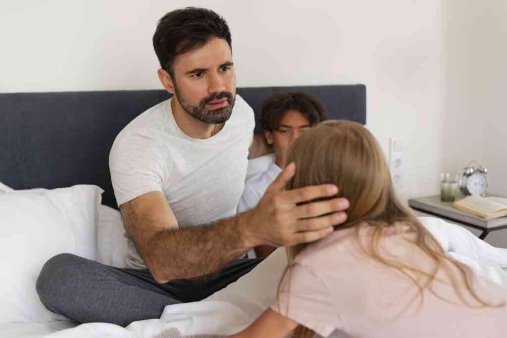 high angle worried father helping girl with lice